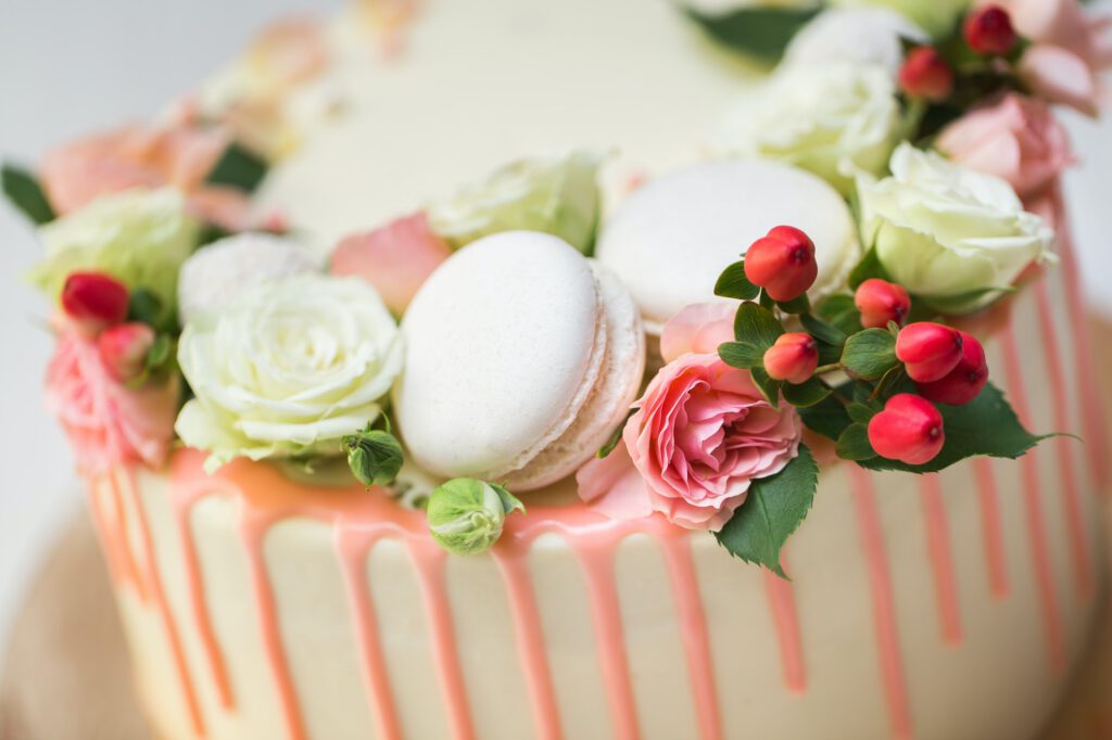 Cake with fresh flowers and almond cookies